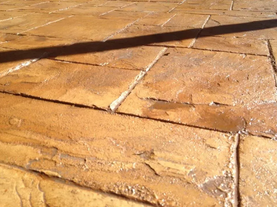Decorative concrete surface featuring textured brick layout