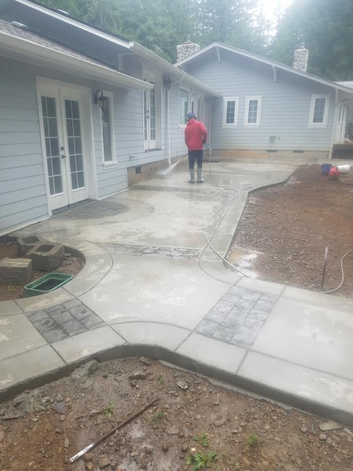 Broom finish sidewalk with integrated stamped concrete panels