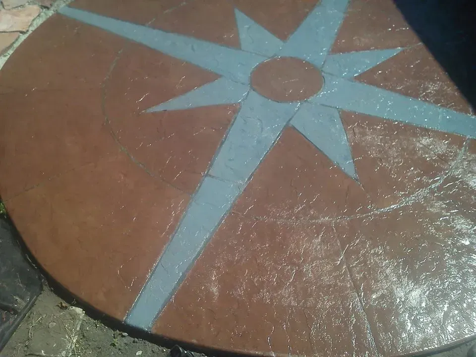 Decorative concrete slab with custom inlaid star pattern