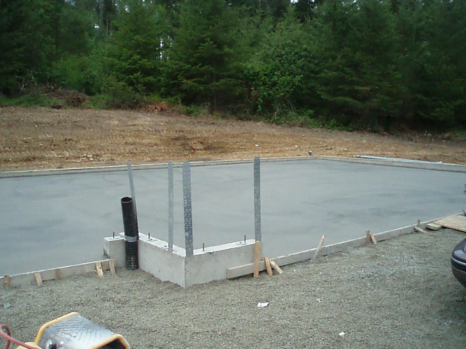 Building foundation installation on compacted gravel base