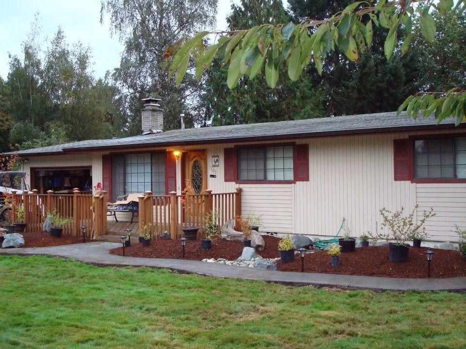 Suburban home exterior with newly poured curved walkway