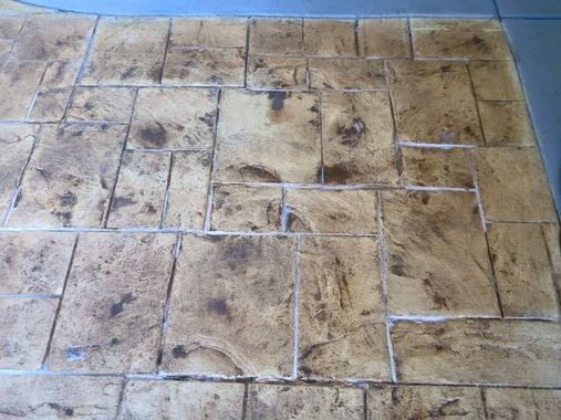 Close up of stamped concrete patio with rectangular stone pattern