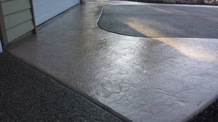 Dark stained and sealed concrete surface with a smooth glossy finish