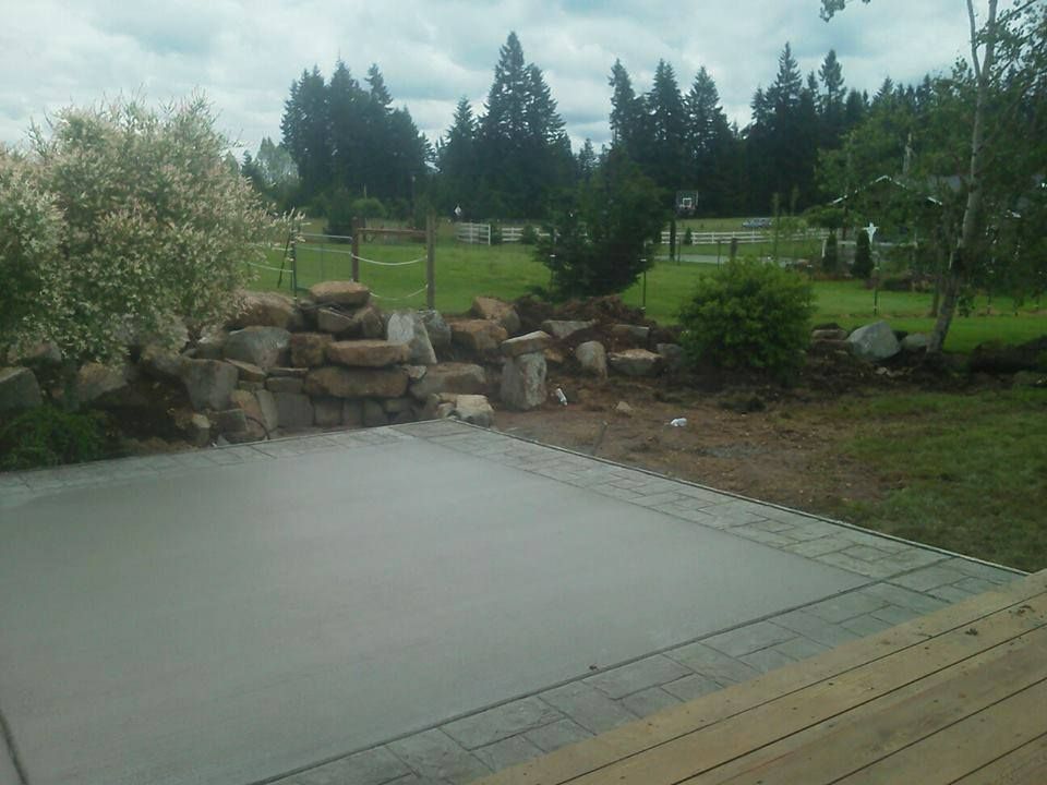 Custom poured patio slab with decorative edge detailing