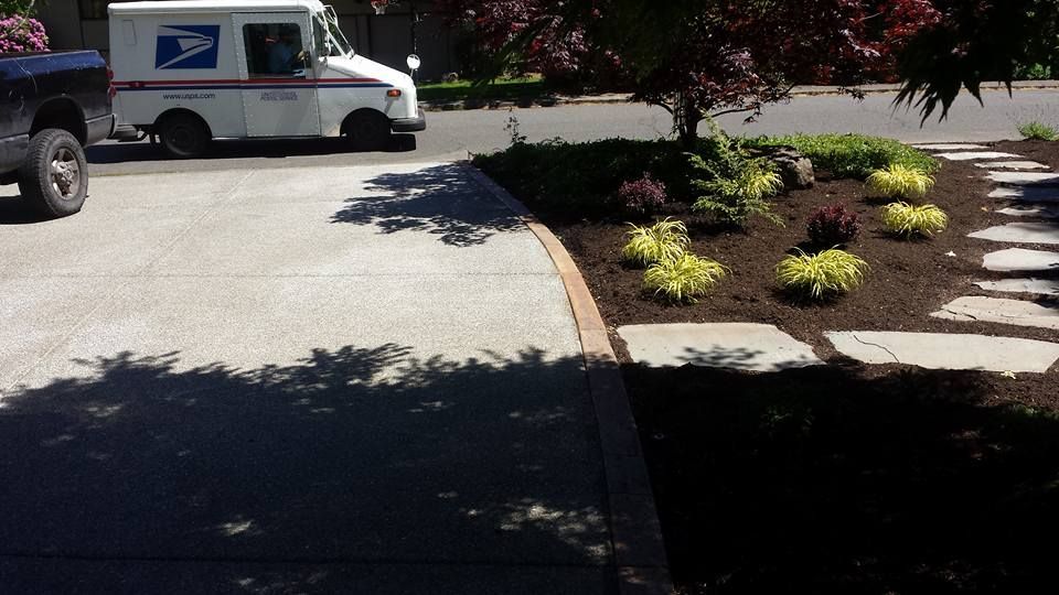 Aggregate concrete flatwork and garden integration
