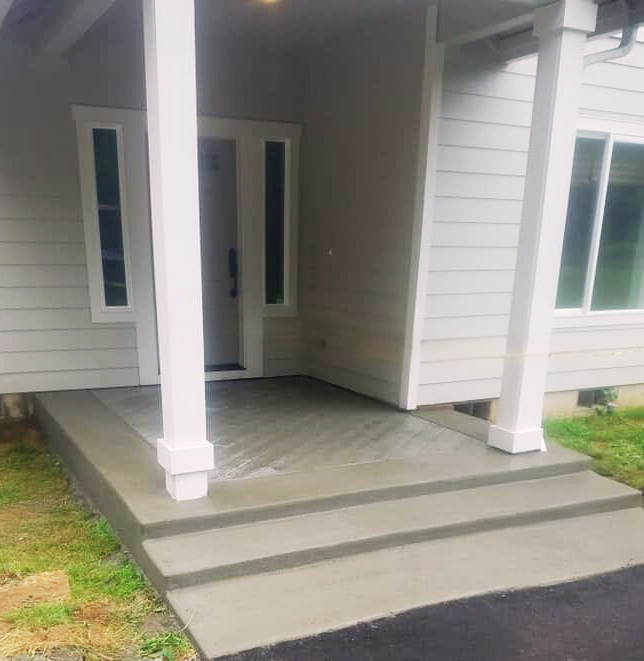 Stamped concrete front porch with realistic wood plank texture