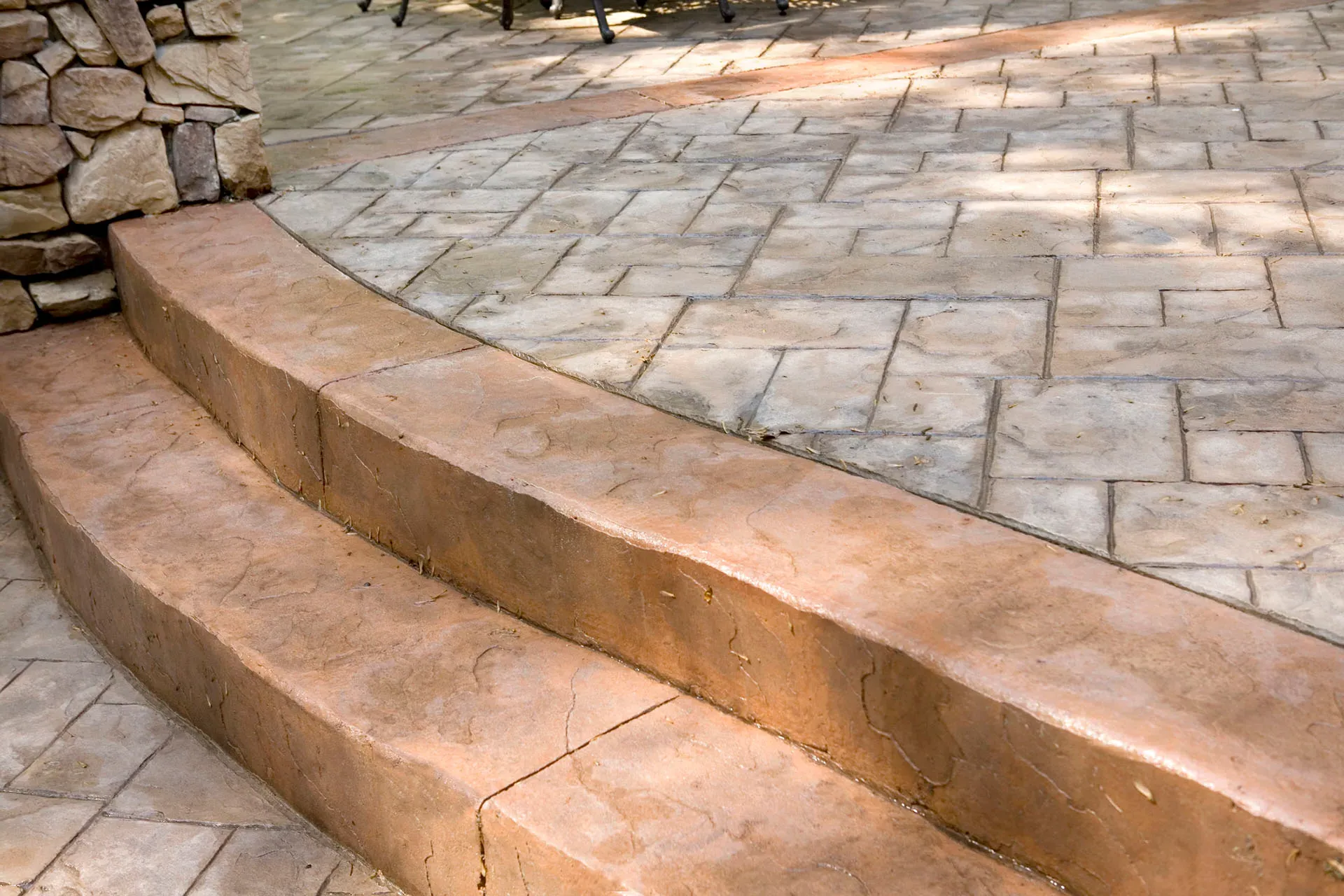 Stamped concrete steps with curved edge transition