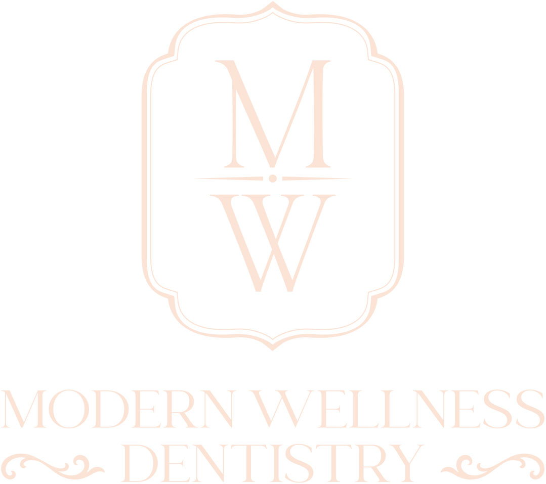 Modern Wellness Dentistry logo with pale pink monogram “MW” in a decorative frame