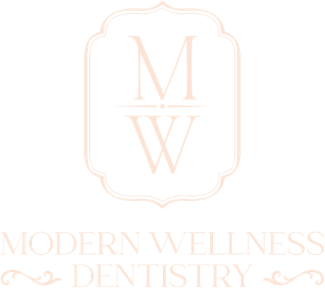 Modern Wellness Dentistry logo with pale pink monogram “MW” in a decorative frame