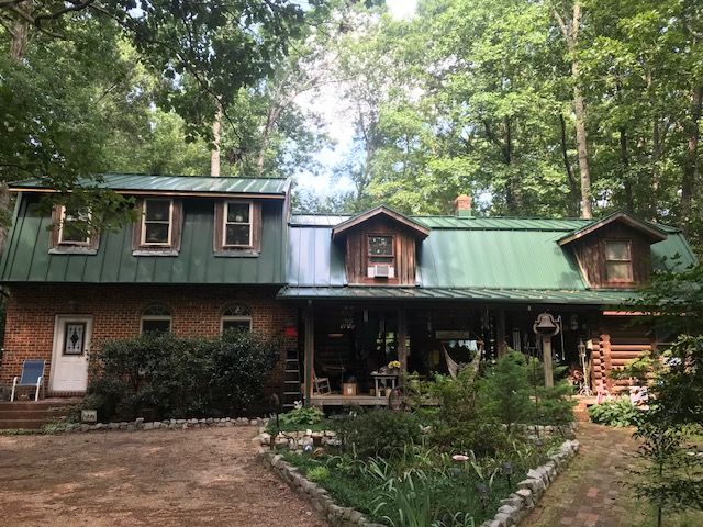 Man Working On The Roof — Petersburg, VA — S W Maclin Roofing Co. Inc.