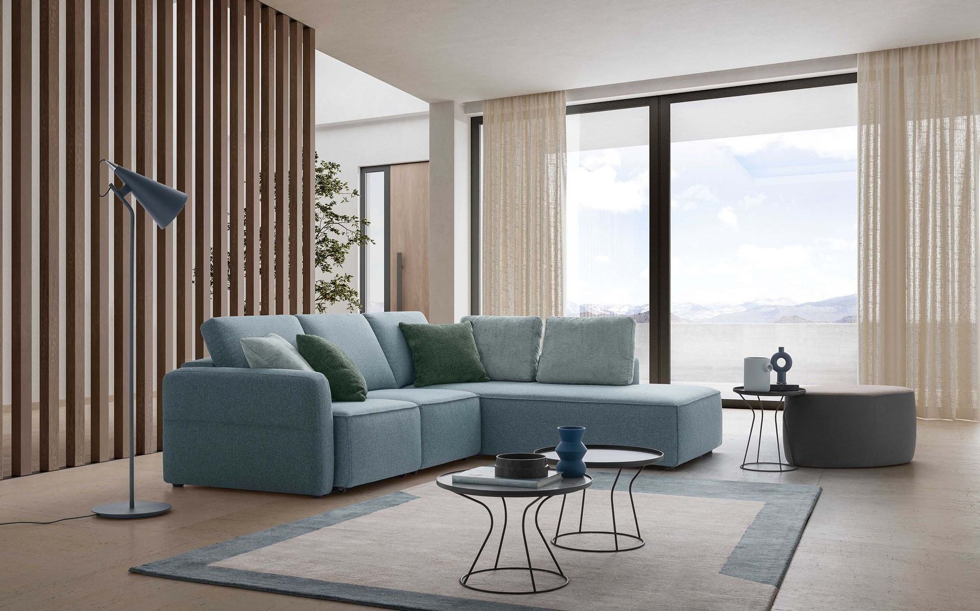 Soggiorno moderno con divano componibile color verde acqua