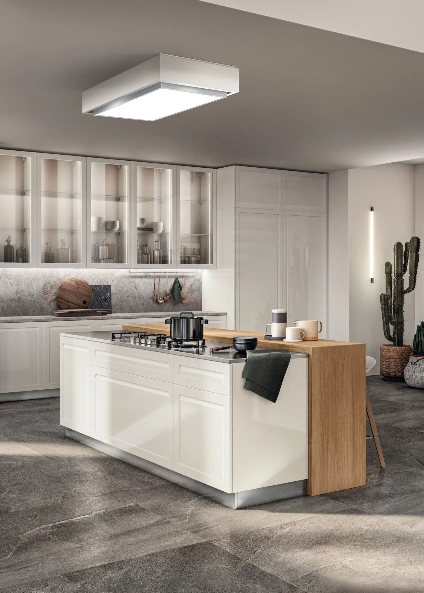 Cucina moderna bianca con isola, dettagli in legno e grande lampadario a soffitto