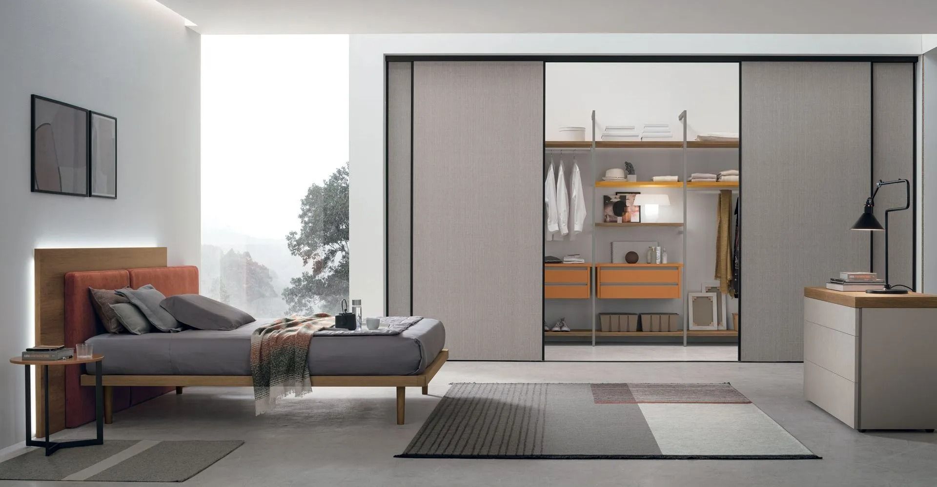 Camera da letto moderna e minimalista con letto basso,