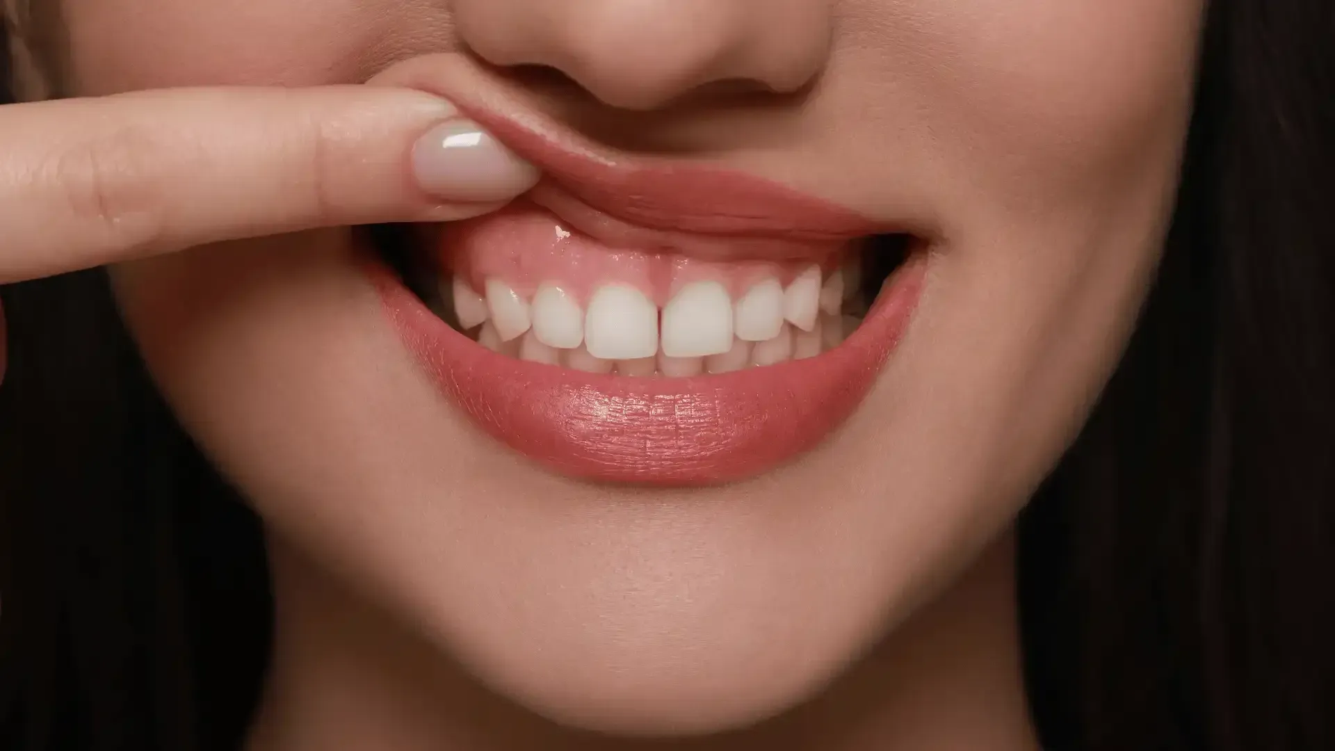 a close up of a woman 's mouth and teeth