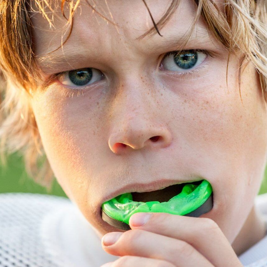 Boy with green mouth guard - Duxton Dental Children's Dentist
