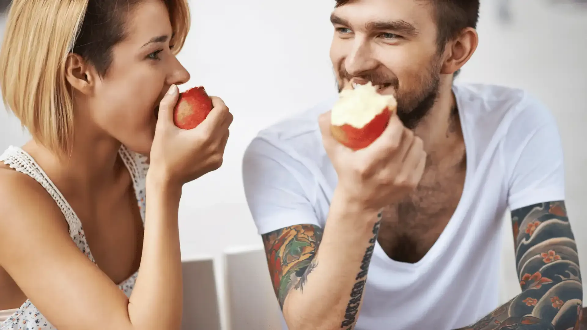 Couple eating an apple