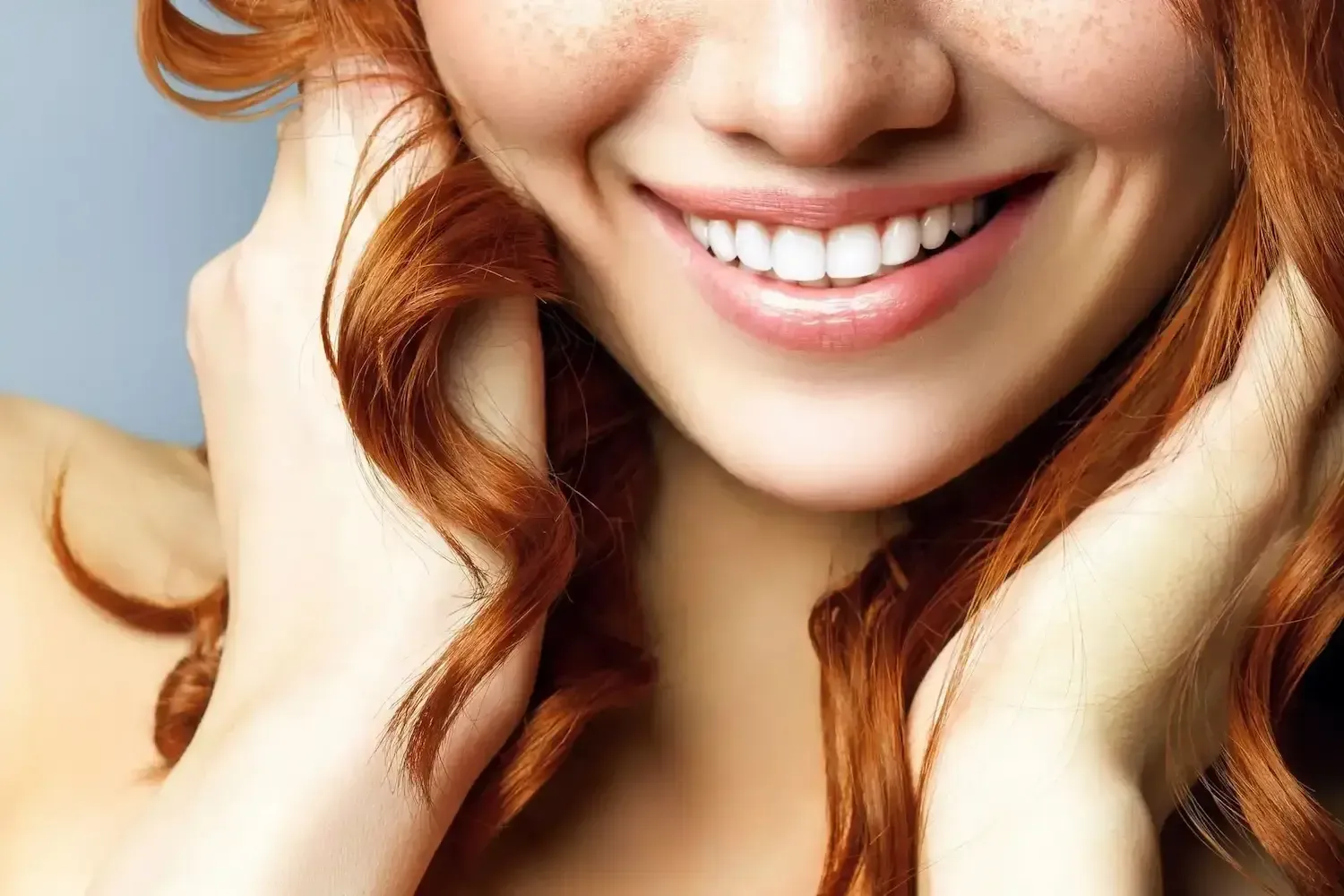 A Close Up Of A Woman With Freckled Hair
