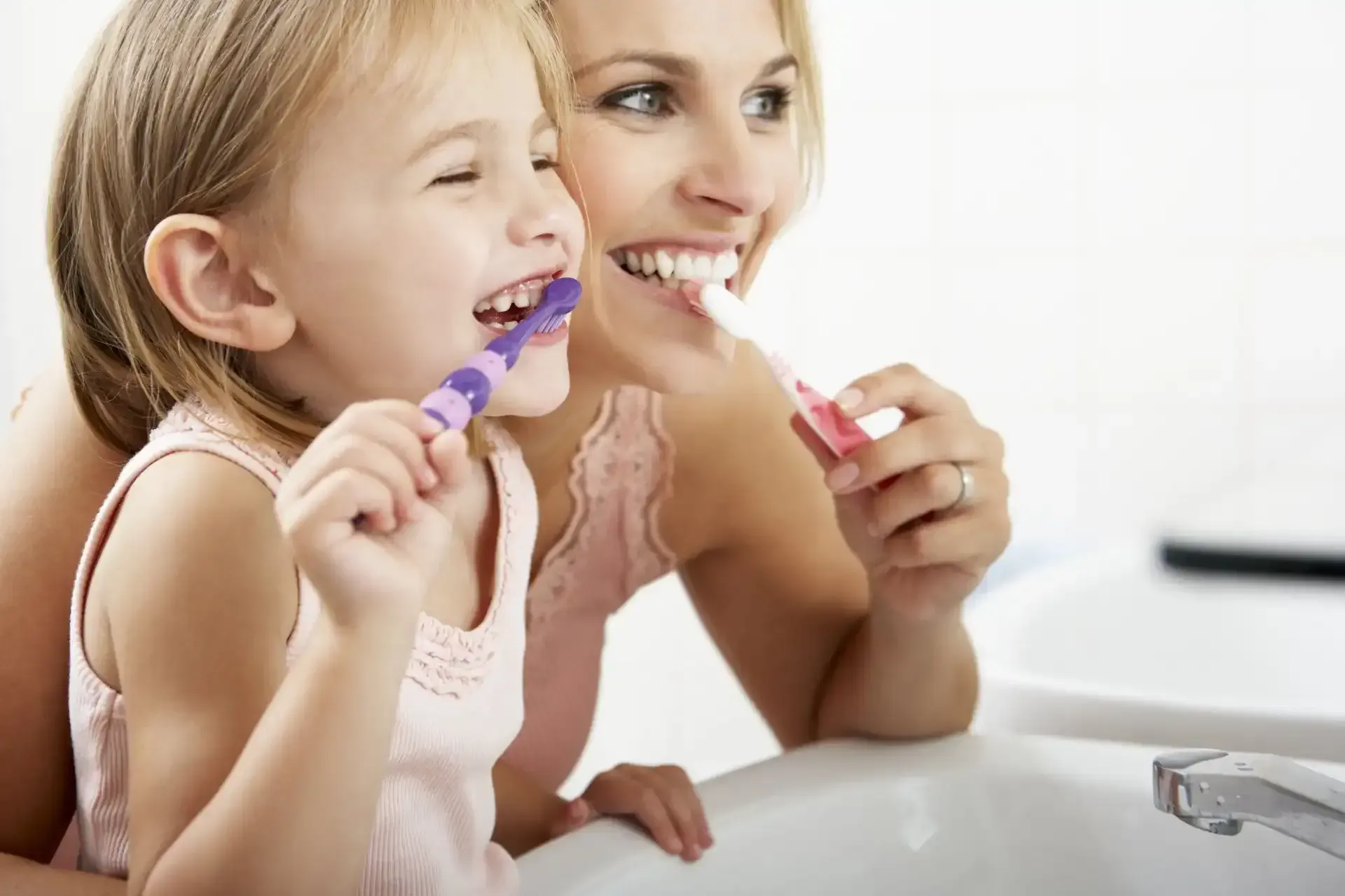 Mother and Daughter brushing teeth together - Duxton Dental - Innovative  Dentist Christchurch
