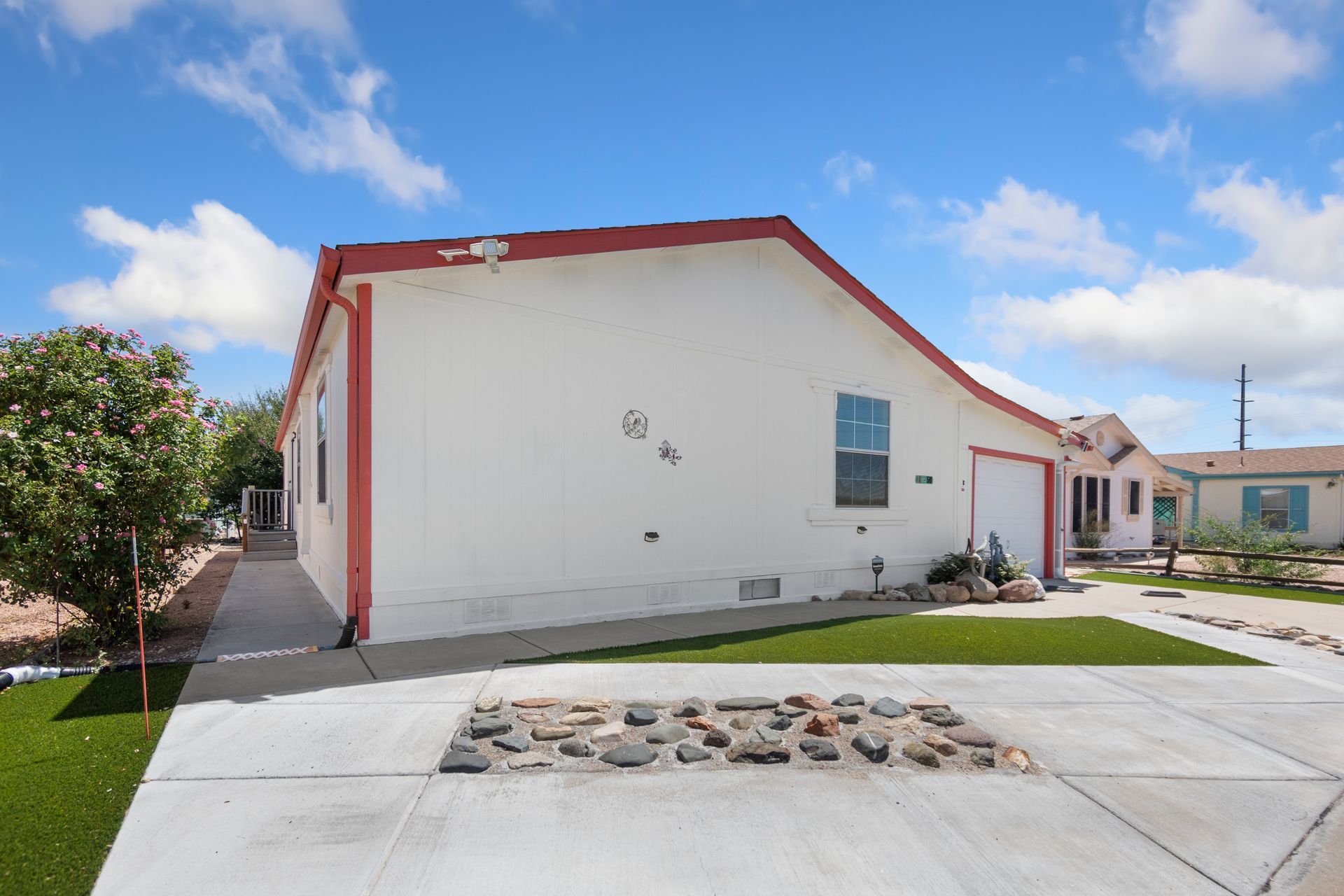 Residential paving featuring a smooth concrete driveway. Residential paving featuring a smooth concrete driveway.