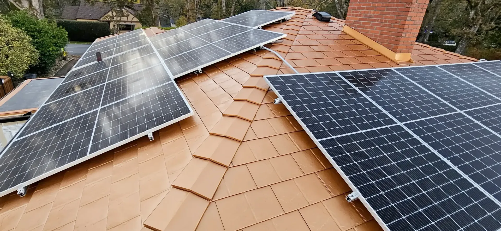A Interlock Metal Roofing System with with a lot of solar panels on it
