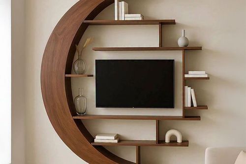 Modern wall-mounted TV with crescent wood shelving and minimalist decor in a living room