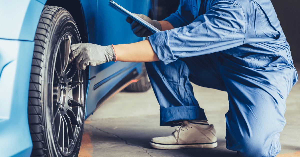 a mechanic doing a pre-purhase car inspection