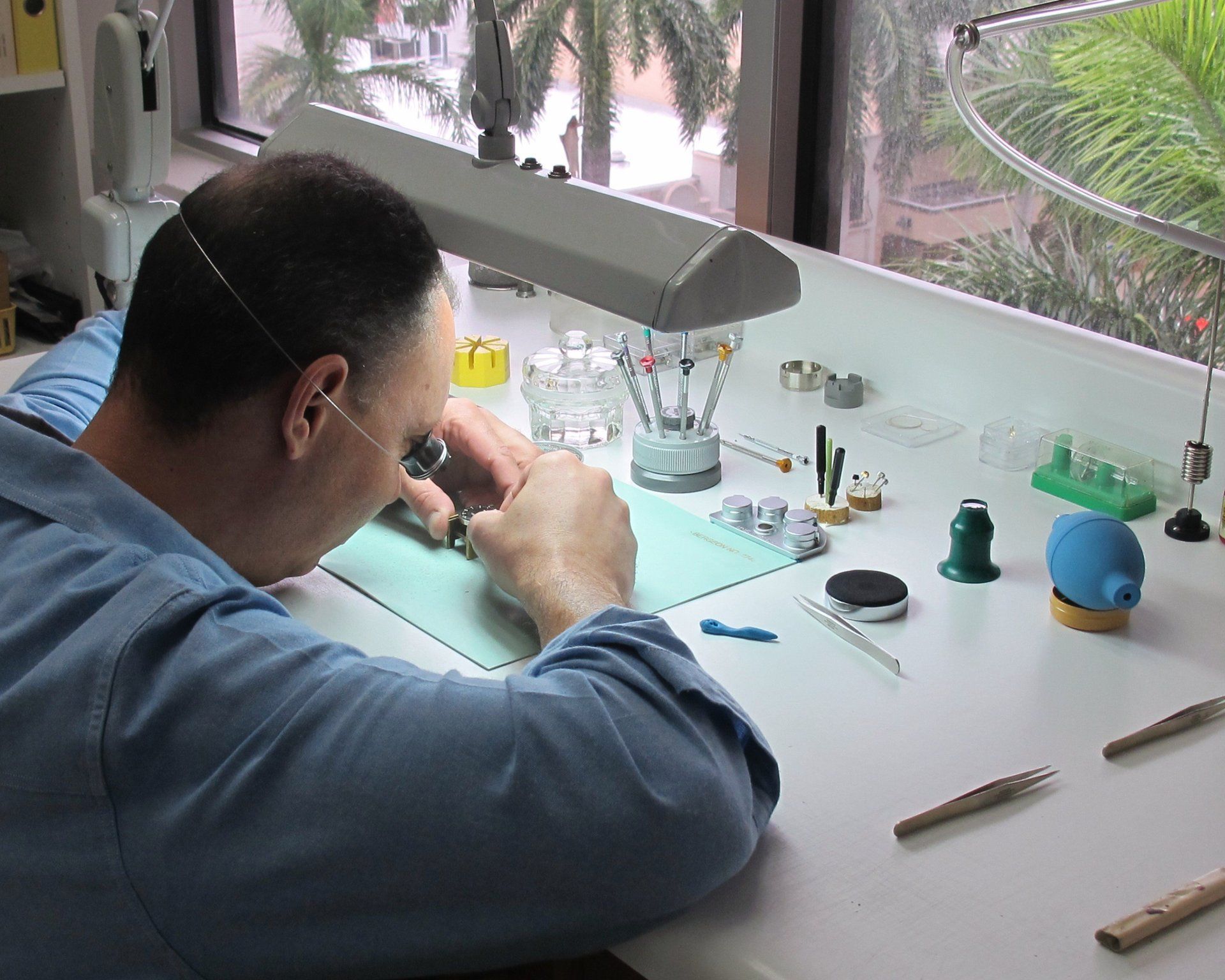master watchmaker working at the bench