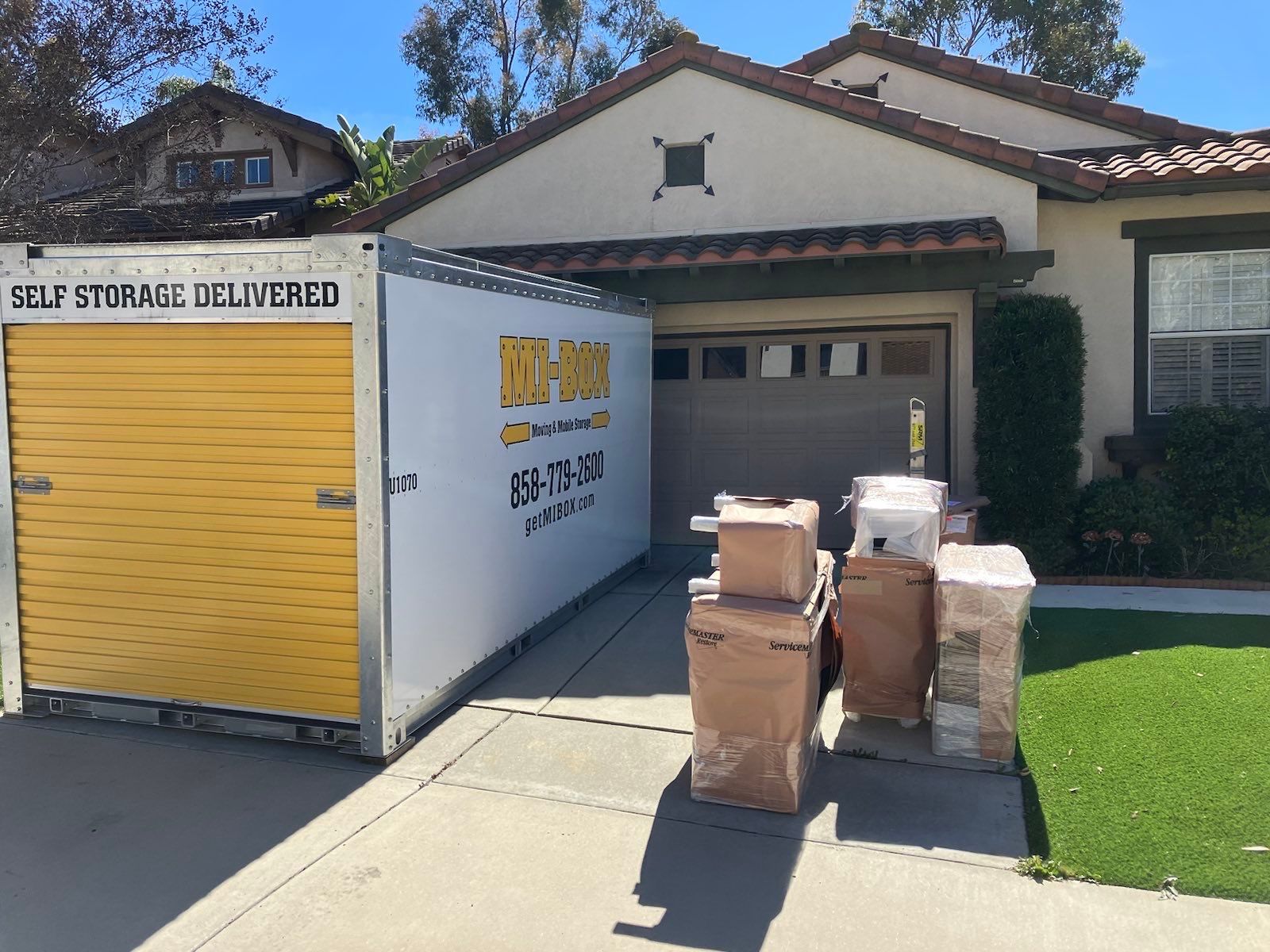 A house with a self storage container in front of it