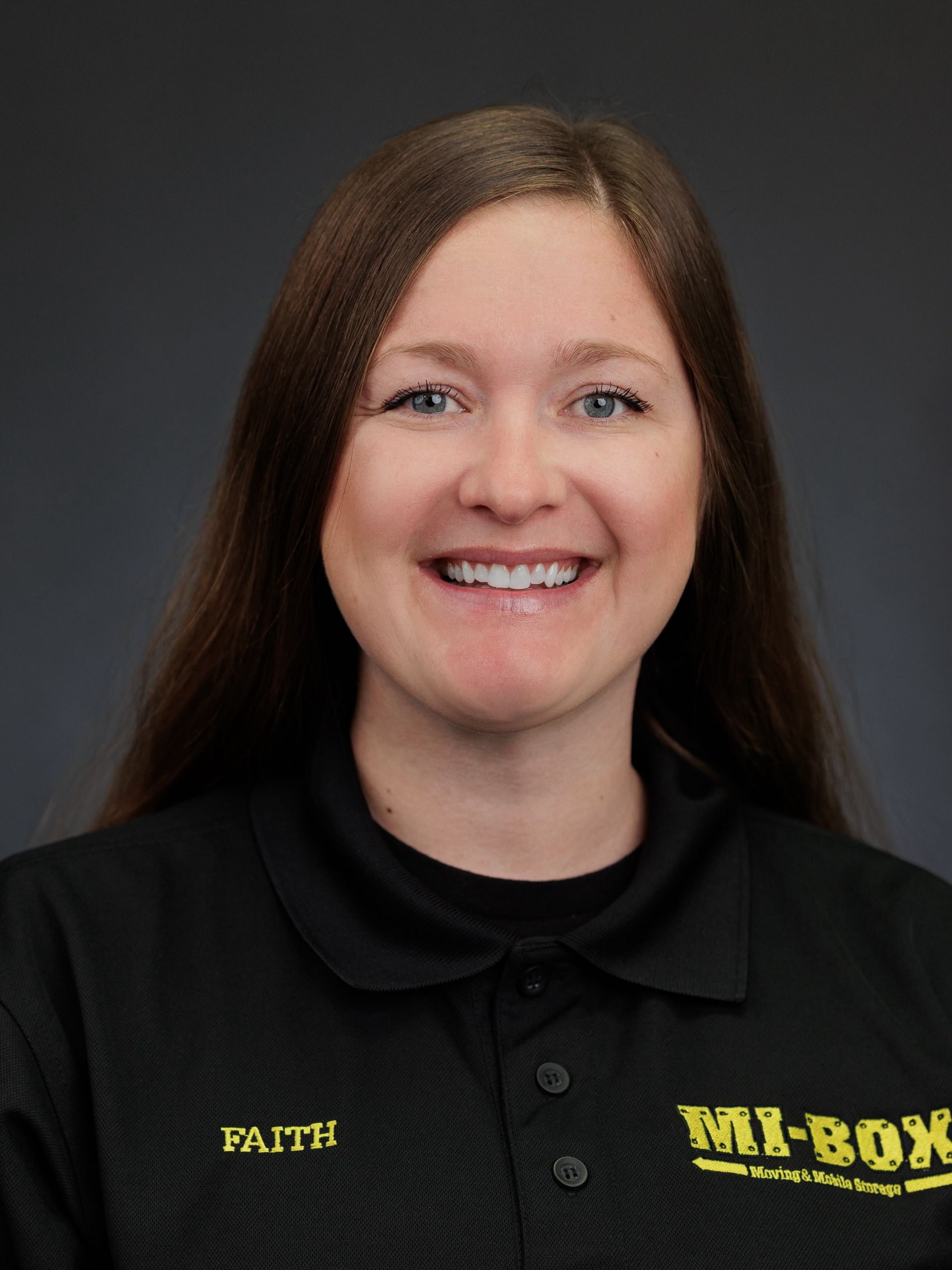 A woman wearing a black shirt with the name faith on it