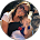 A blurry picture of a woman holding a baby in a circle.