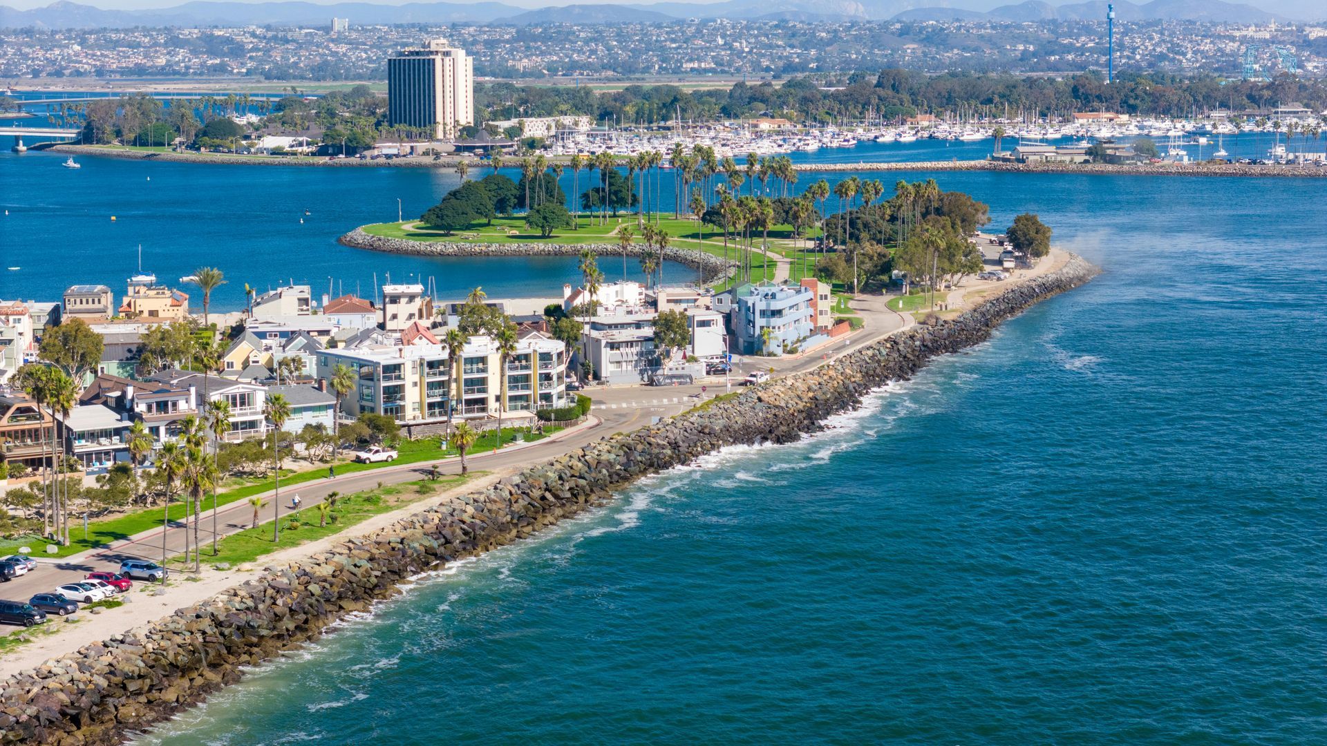 An aerial view of a city next to a body of water.