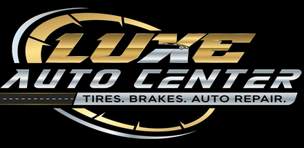 Luxe Auto Center logo with gold and silver text and a tire graphic on black background
