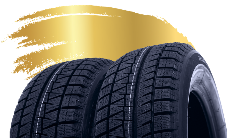 Two black car tires with a gold paint splash background