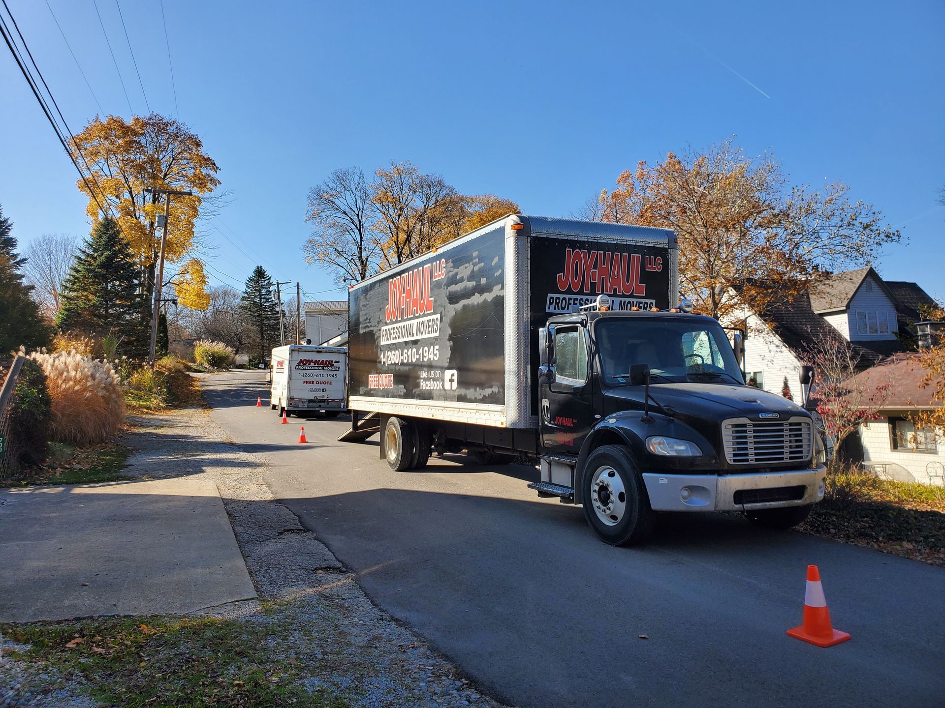 a joyhall truck is parked on the side of the road