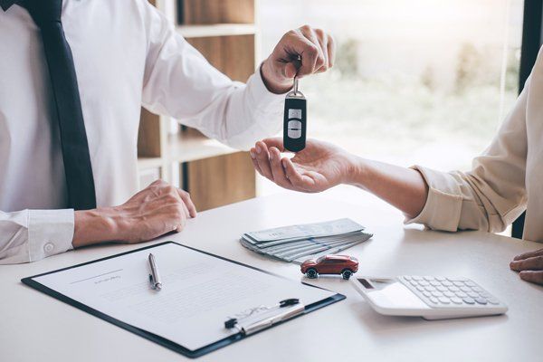 key of new car giving woman