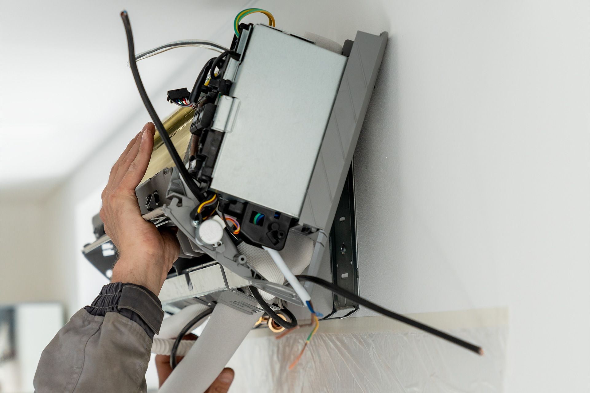 AC technician inspecting Delray Beach unit