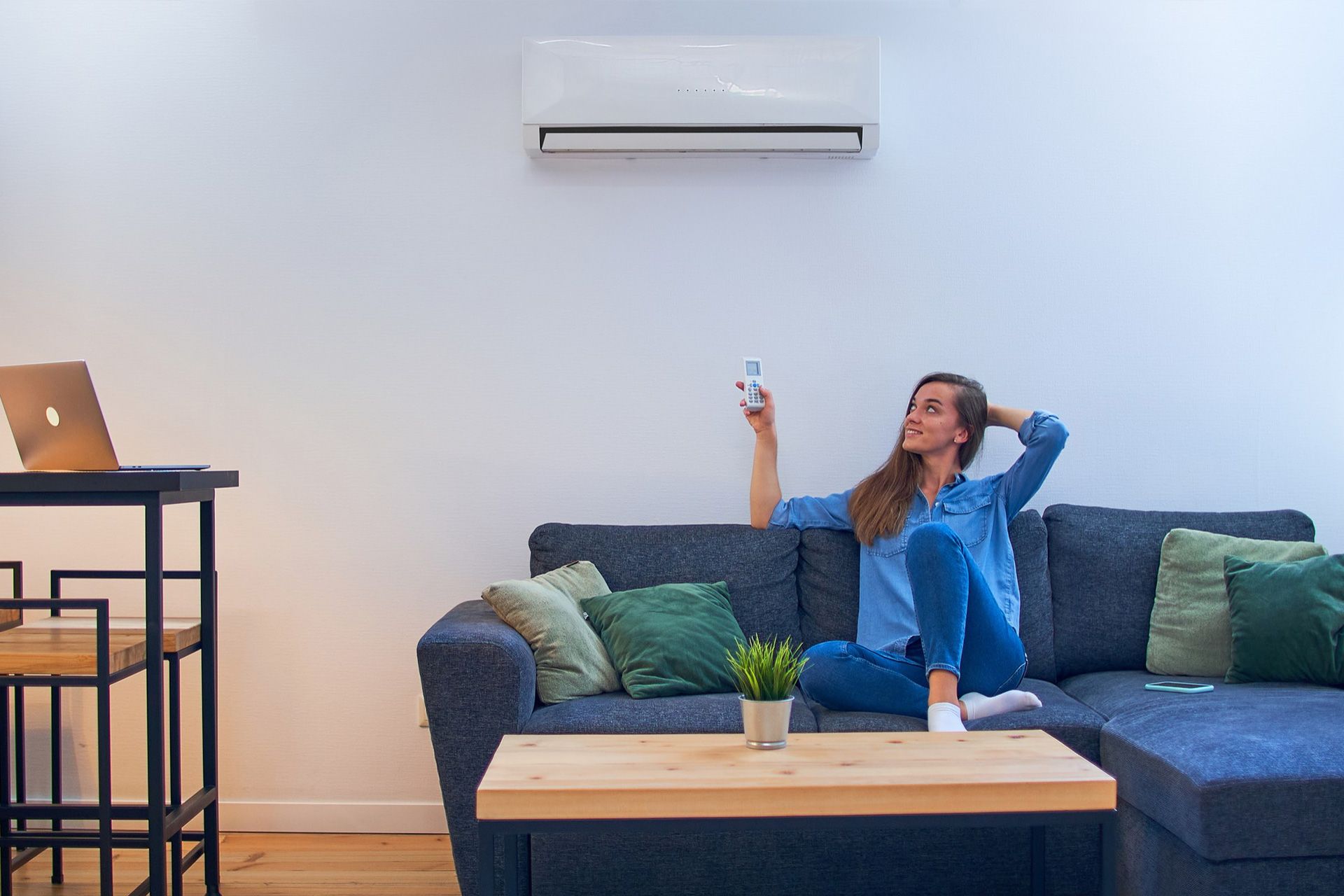 Technician calculating correct home AC unit size