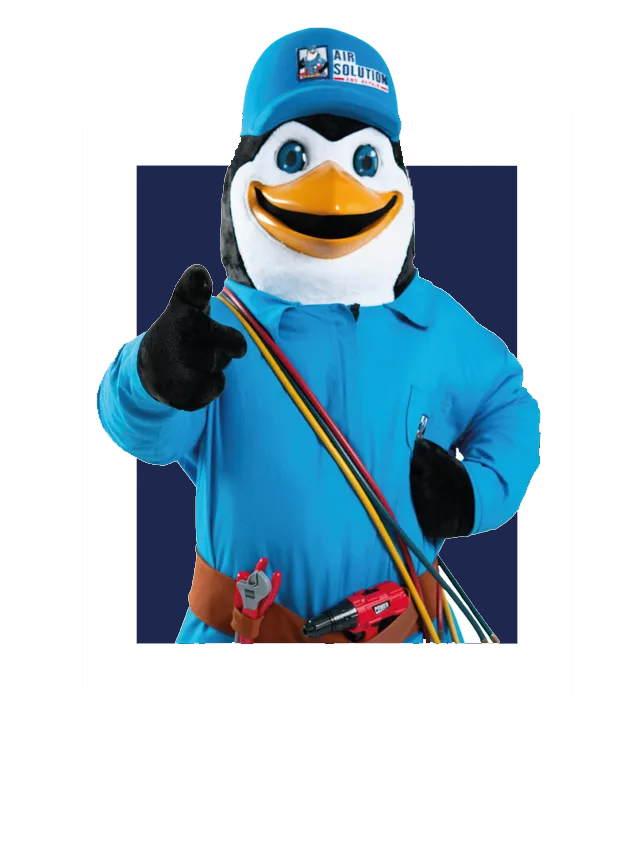 Mascot penguin in blue outfit and cap pointing at the viewer with a colorful strap across its chest