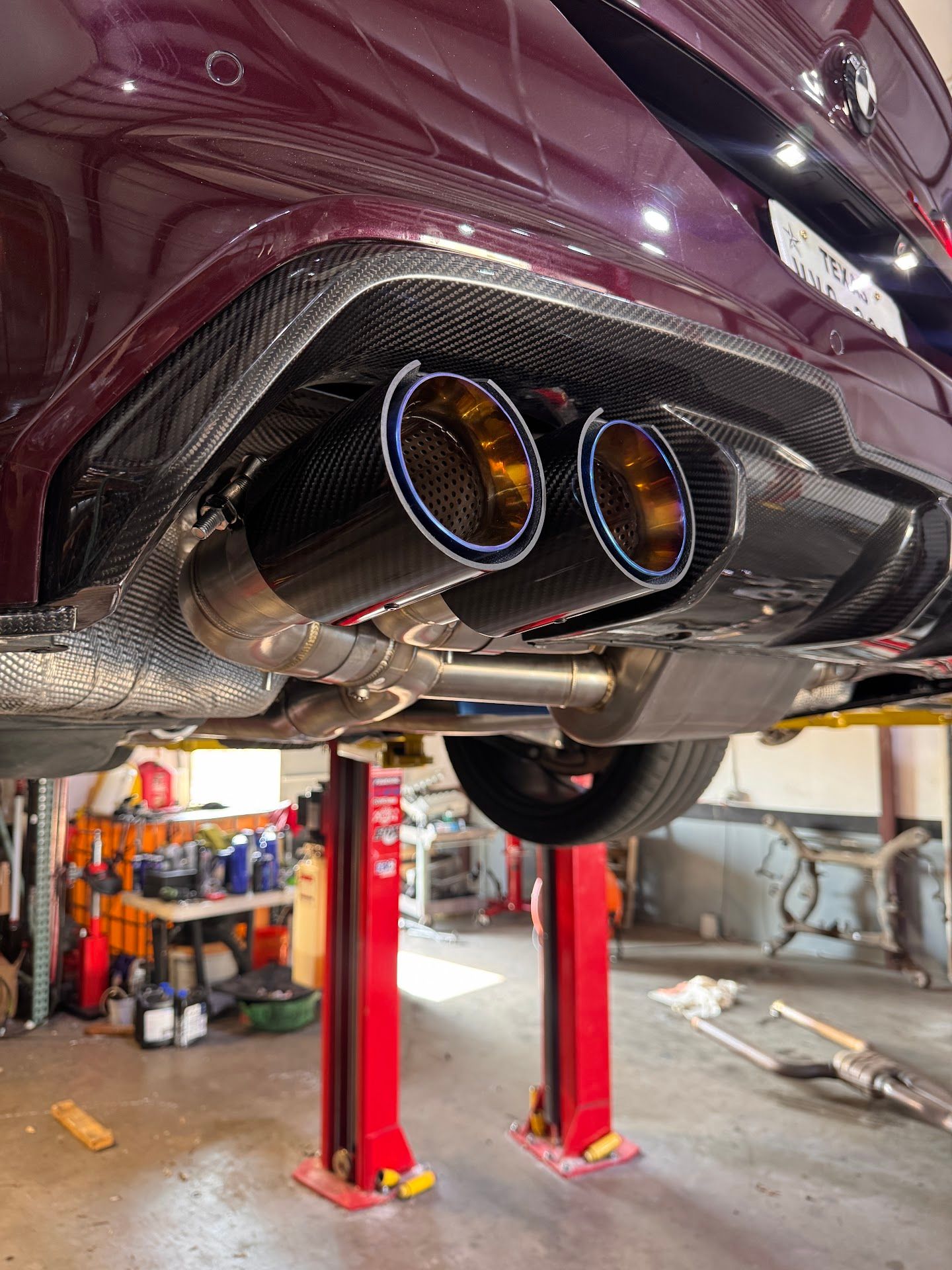 Dual Exhaust Tips On A Vehicle During Shop Service | United Euro