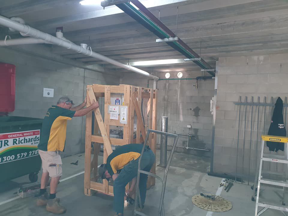 Team Installing Hot Water Heater System — Hot Water Maintenance in Wauchope, NSW