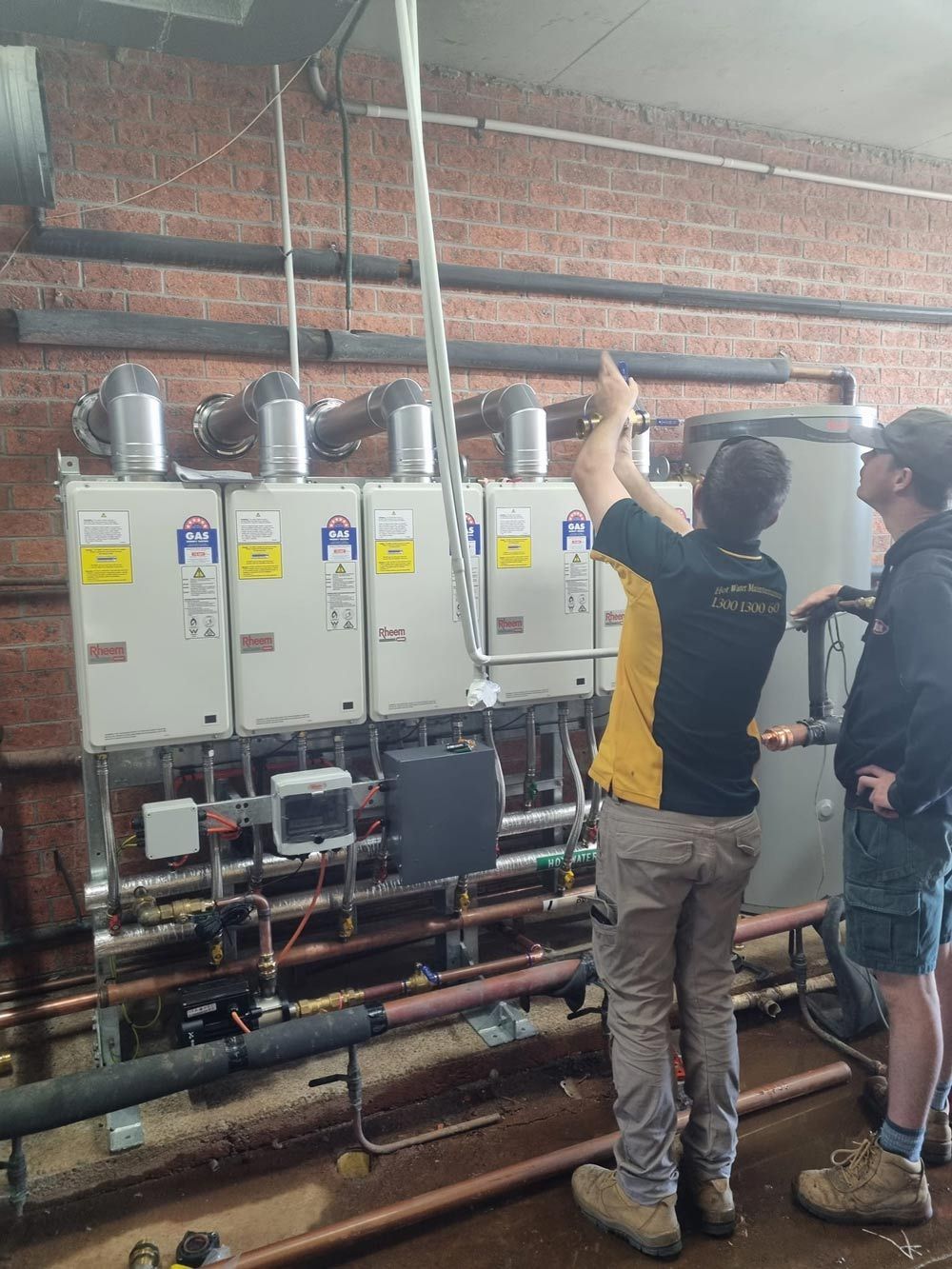 Technician Fixing the Heater Boiler — Hot Water Maintenance in Crescent Head, NSW