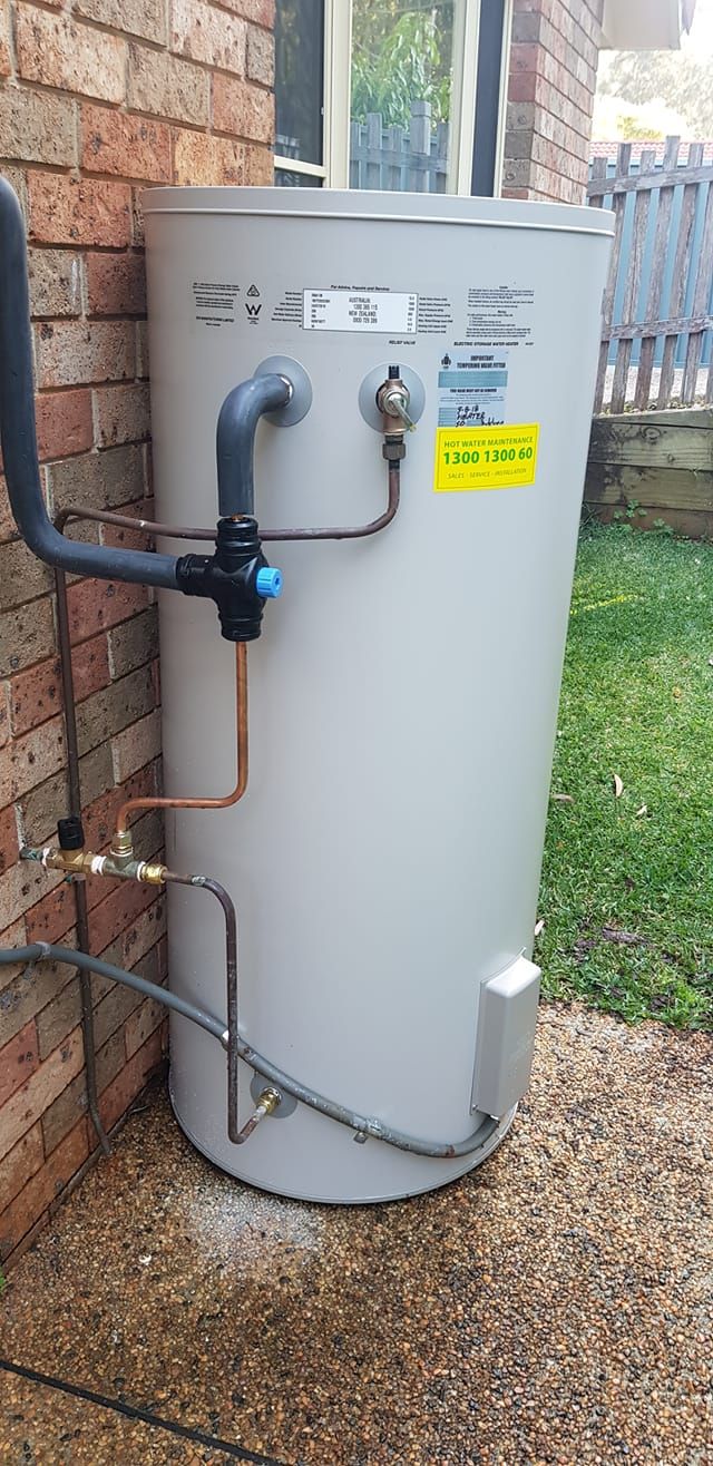 An Outdoor Residential Water Heater — Hot Water Maintenance in Laurieton, NSW