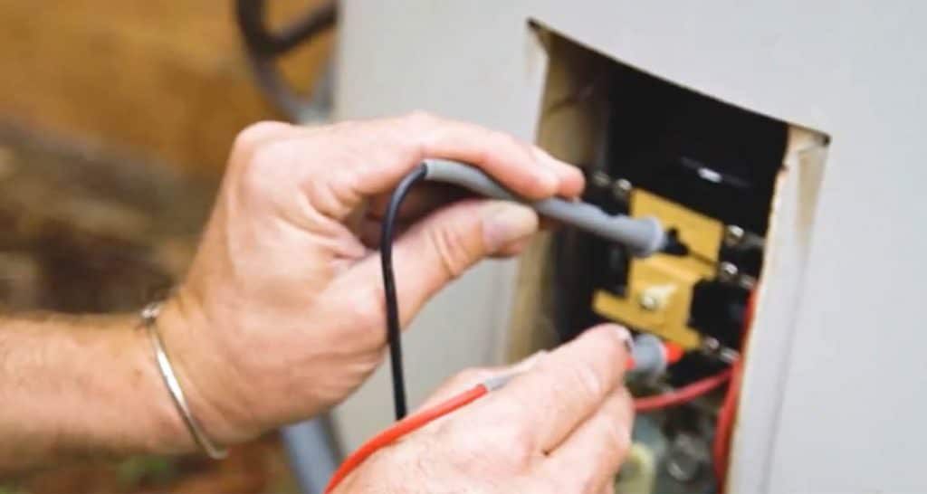 Plumber Fixing the Connection and Wire of Water Heater — Hot Water Maintenance in Port Macquarie, NSW