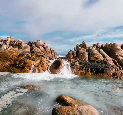 Waves Crashing Over the Rocks — Hot Water Maintenance in South West Rocks, NSW