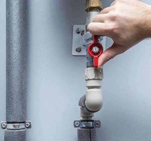 Man Working at Pipes — Hot Water Maintenance in South West Rocks, NSW
