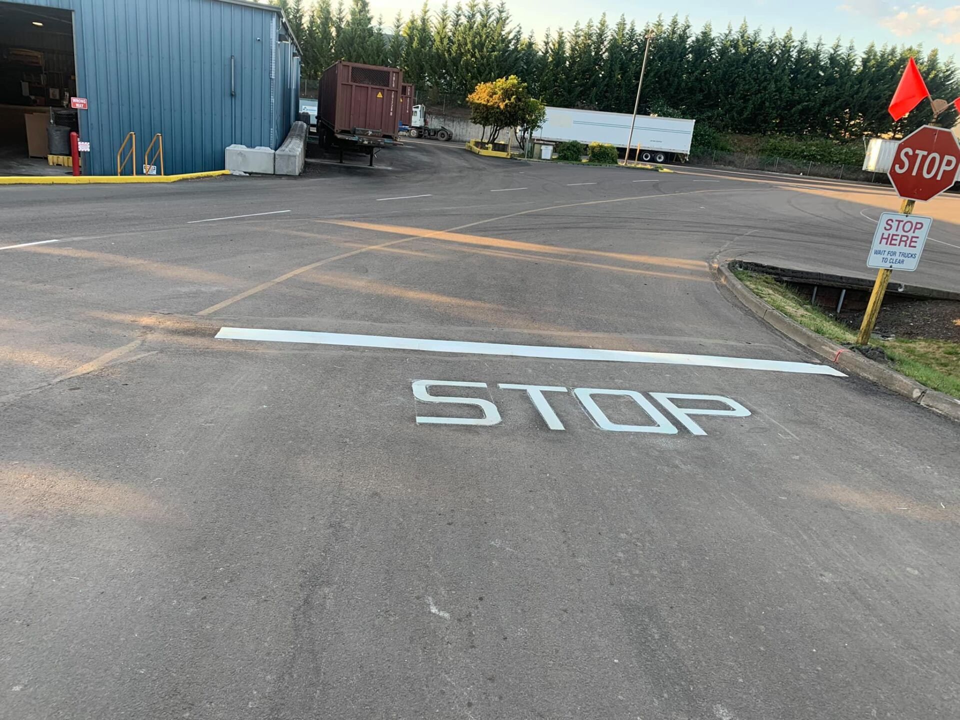 A stop sign is painted on the side of a road.