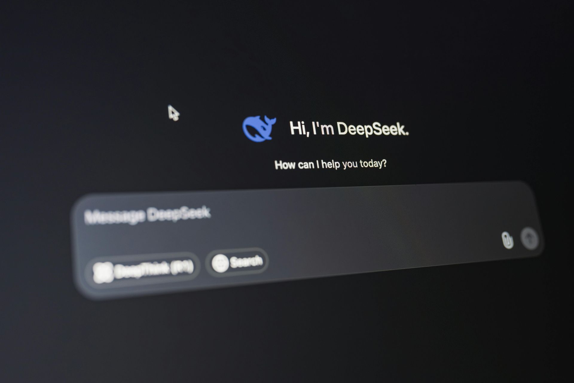 Dark ChatGPT-style welcome screen with “Hi, I’m DeepSeek” and a “Message DeepSeek” input box