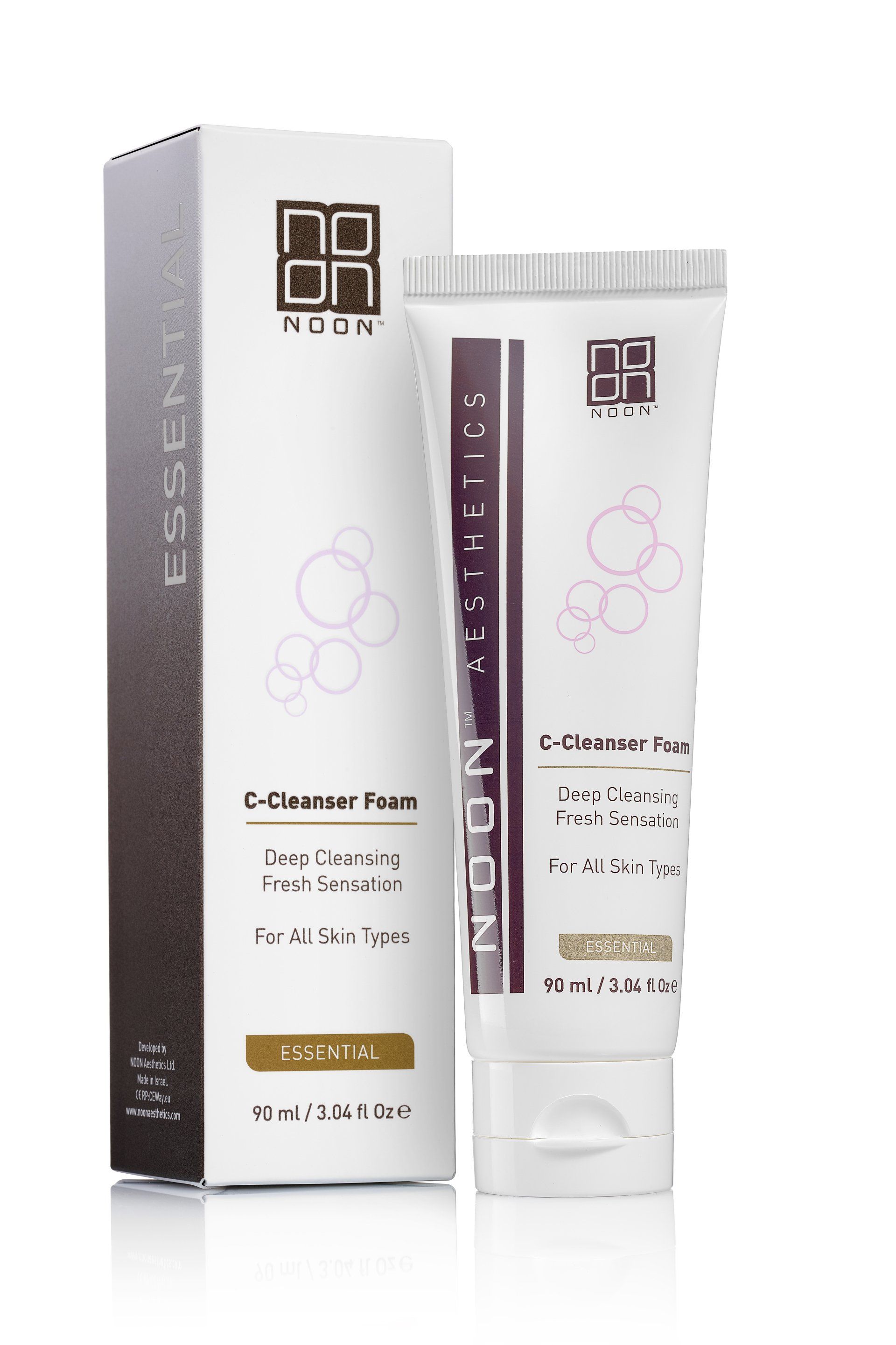 White skincare tube and box with gold and purple accents on a plain background