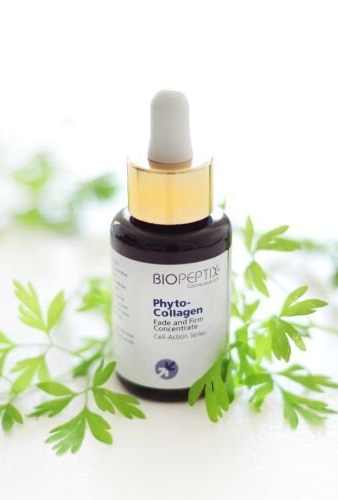 Bio-Peptide phytocollagen serum bottle with dropper, surrounded by green leaves on a white background