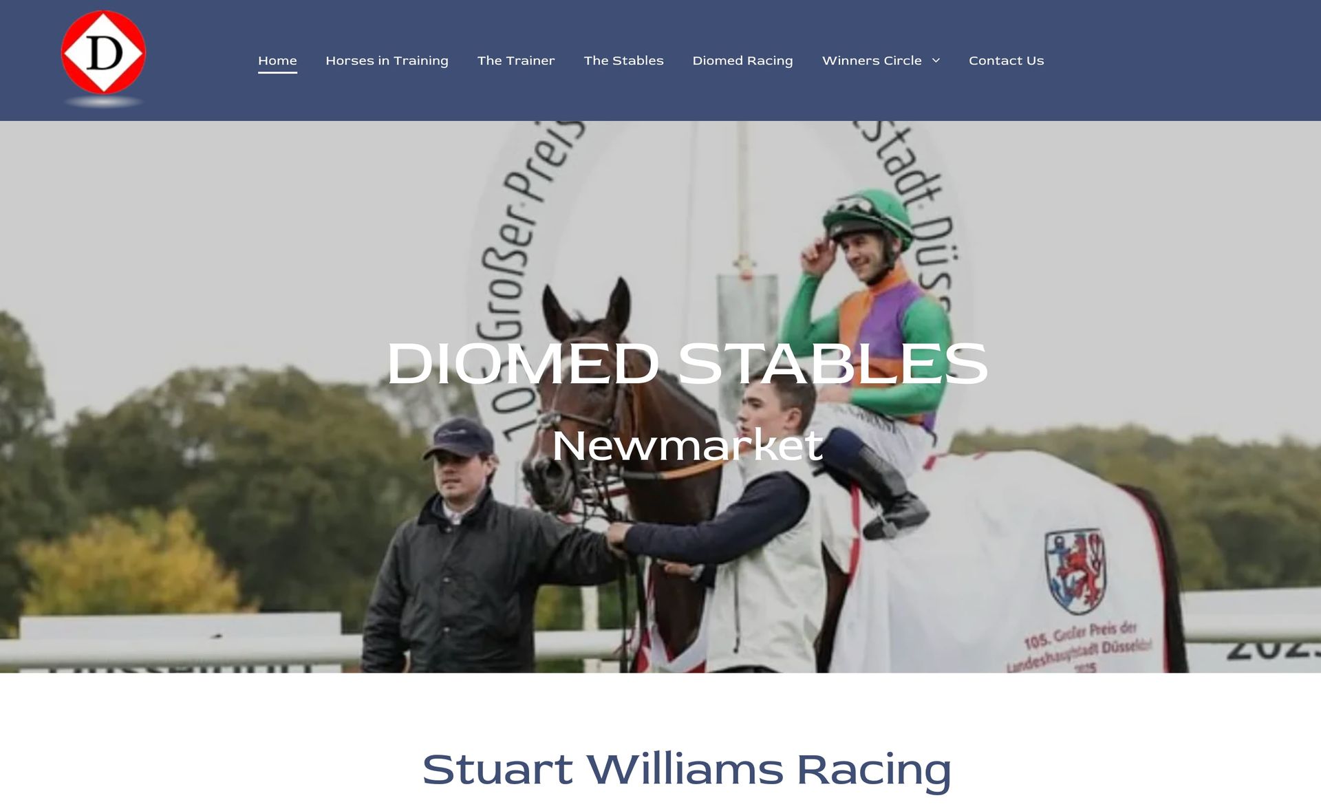 Jockey on a white horse in front of Diomed Stables banner at Newmarket racecourse